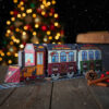calendrier-avant-noel-train Calendrier de l’Avent en forme de train, garni de chocolats artisanaux Papa Gâteau, présenté dans un décor festif de Noël.